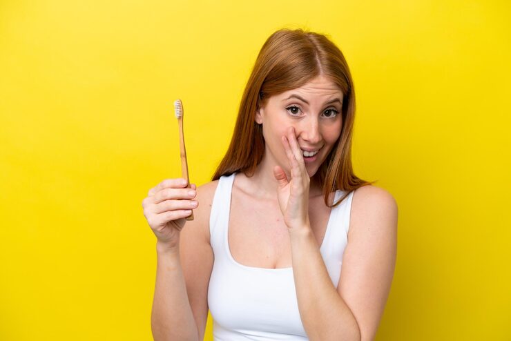 woman worried about yellow teeth